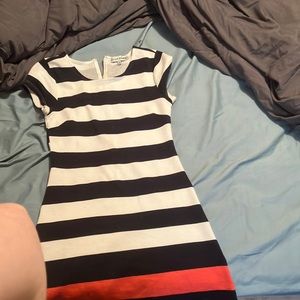 This dress is from the company almost famous its a size medium in good condition